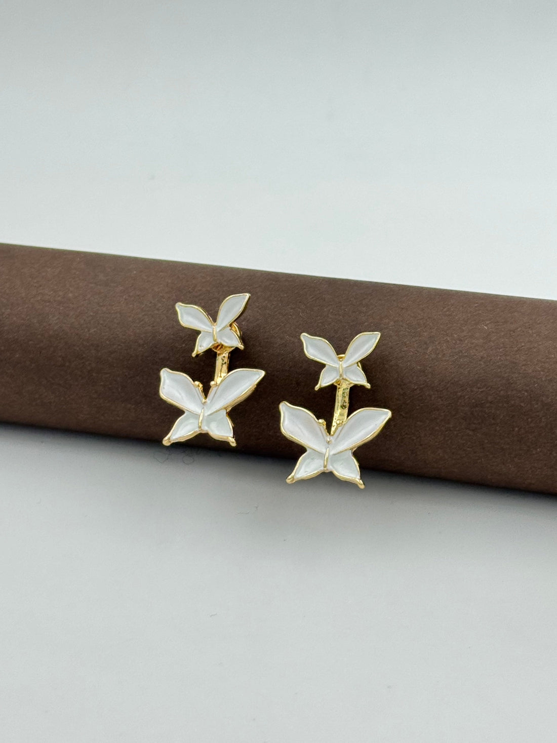 White butterfly drop earrings