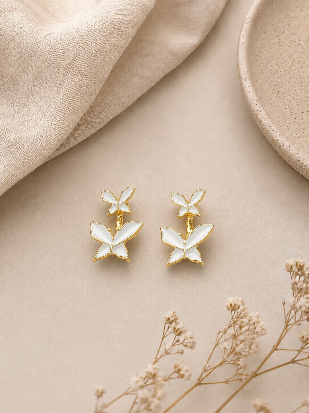 White butterfly drop earrings